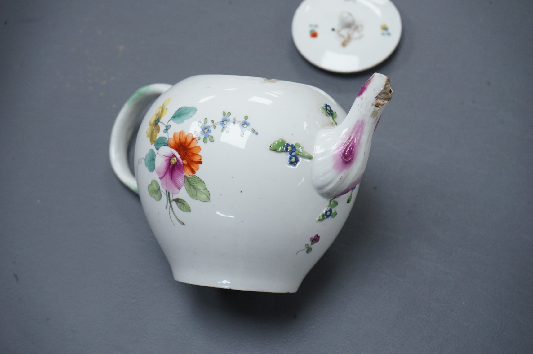 The Hague, a late 18th century soft paste porcelain teapot, painted with polychrome flowers, 12cm high